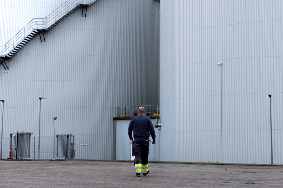 Employee walking on a biogas plant